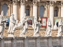 Statuary sits before imagery of the recently canonized saints in St. Peter's Square at the Vatican, Sunday, Oct. 20, 2024