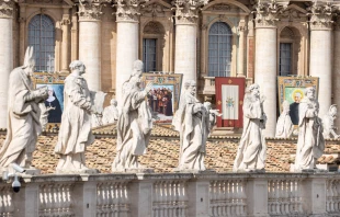 Statuary sits before imagery of the recently canonized saints in St. Peter's Square at the Vatican, Sunday, Oct. 20, 2024 Credit: Daniel Ibáñez/CNA