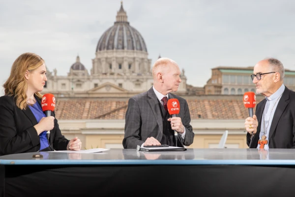 Cardinal Michael Czerny, SJ, talks with Catherine Hadro and Matthew Bunson on the set of EWTN News live from the Synod on Synodality in Rome, Oct. 24, 2024. Credit: Daniel Ibáñez/CNA