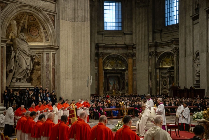 Pope Francis prays at the consistory for the creation of 21 new cardinals at St. Peter