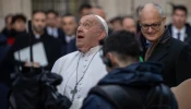 Pope Francis gazes up at the bronze statue of Mary atop the 39.4-foot column at Rome's Spanish Steps, Dec. 8, 2024.