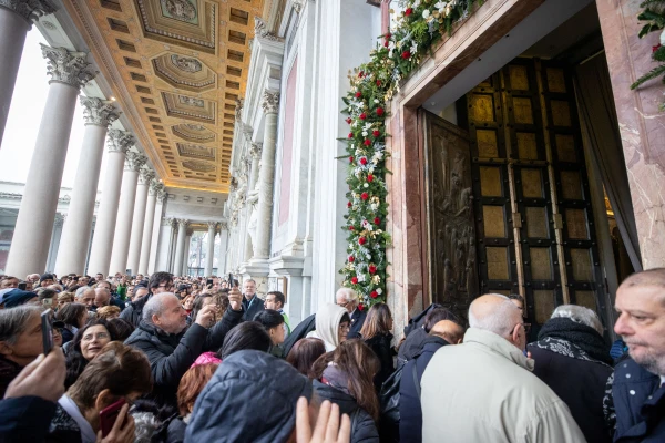 Pilgrims pass through the Holy Door at the Basilica of St. Paul Outside the Walls on Jan. 5, 2025. Credit: Daniel Ibañez/CNA