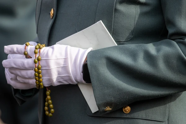 A military officer holds a rosary and service booklet during the Armed Forces Jubilee Mass in St. Peter's Square on Feb. 9, 2025. Credit: Daniel Ibáñez/CNA