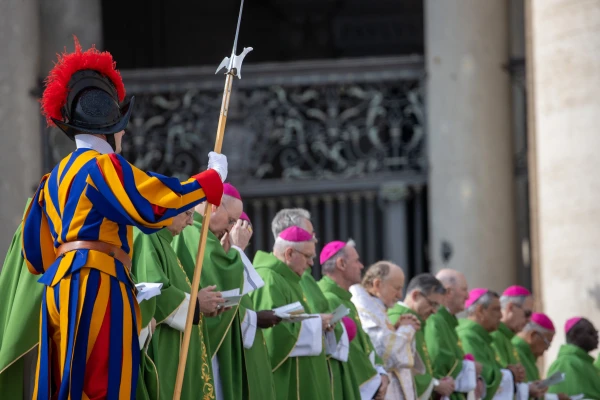 A Swiss Guard stands alongside bishops during the Armed Forces Jubilee Mass in St. Peter’s Square on Feb. 9, 2025. Credit: Daniel Ibáñez/CNA