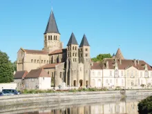 Roman Basilica of the Sacred Heart of Paray-le-Monial and cloister. View from the Bourbince River, 2023.
