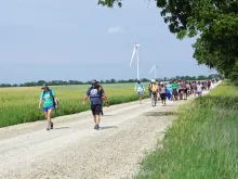 Pilgrims walk the Kansas Camino, which goes from Wichita to Father Emil Kapaun’s home parish in rural Pilsen, Kansas.