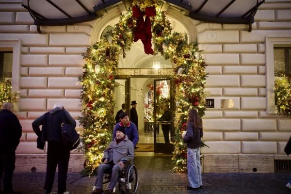 A building is decorated festively for Christmas in Rome, Italy, Dec. 17, 2024. Credit: Courtney Mares/CNA