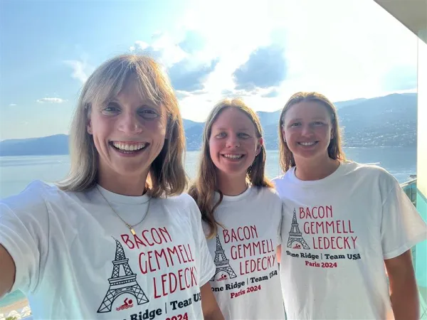 Team USA swimming members and Stone Ridge alumni Katie Ledecky (‘15), Erin Gemmell (‘23), and Phoebe Bacon (‘20) pose in their alma-mater’s custom T-shirts. They will be competing in the Paris Olympics from July 26–Aug. 11, 2024. Credit: Stone Ridge of the Sacred Heart School