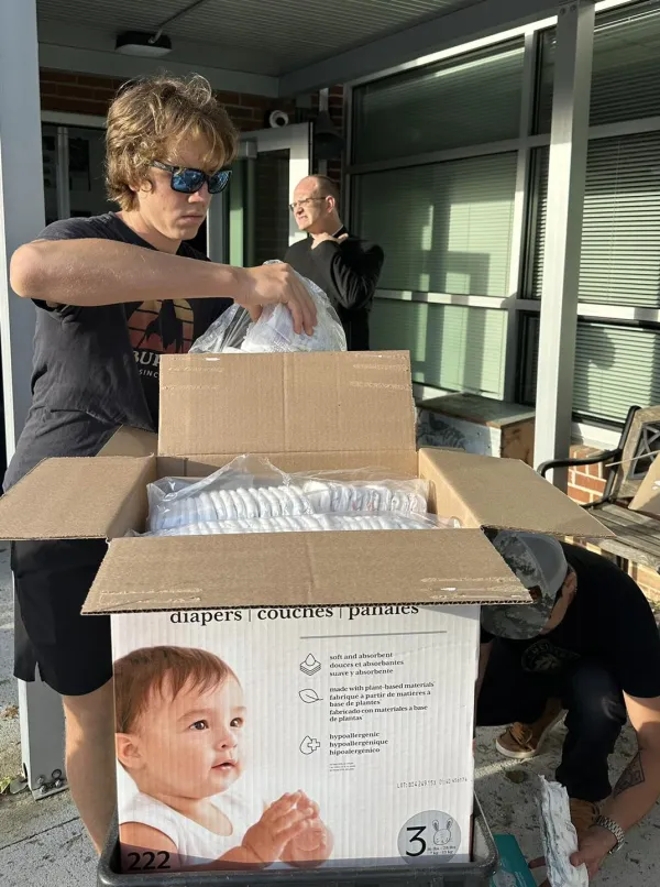 A volunteer distributes baby diapers at Immaculata Catholic School in Hendersonville, North Carolina, October 2024. Credit: Immaculata Catholic School