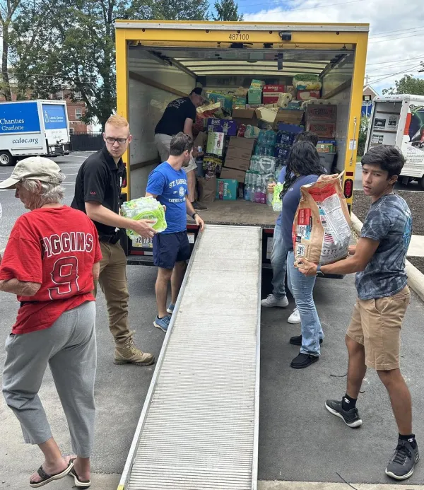 Volunteers unload a truck of relief supplies at Immaculata Catholic School in Hendersonville, North Carolina, October 2024. Credit: Immaculata Catholic School