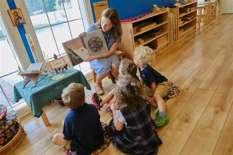 Teacher Rose Dussault reads aloud to pre-K students at St. Benedict Classical Academy in Natick, Massachusetts.?w=200&h=150