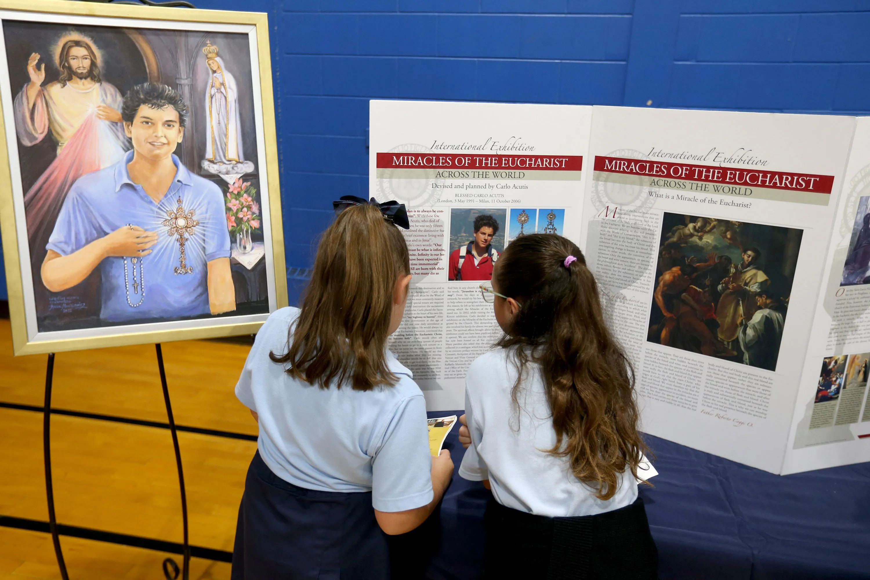 School children read about the life of Blessed Carlo Acutis at the celebration of his new shrine at St. Dominic Parish in Brick, New Jersey. Oct, 1, 2023.?w=200&h=150