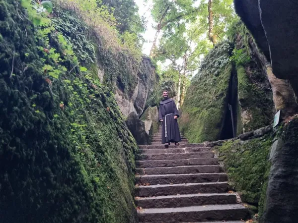 Brother Matteo Brena, Secretary for the 800th Anniversary Celebrations walking down to the splits in the rock where st. Francis used to pray. Credit: Alexey Gotovskiy EWTN/CNA