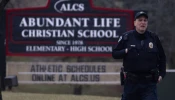 A police officer stands guard in front of Abundant Life Christian School on Dec. 16, 2024, in Madison, Wisconsin. According to reports, a student and teacher were shot and killed at the school earlier today, and the suspected shooter was found dead at the scene.