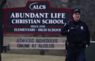 A police officer stands guard in front of Abundant Life Christian School on Dec. 16, 2024, in Madison, Wisconsin. According to reports, a student and teacher were shot and killed at the school earlier today, and the suspected shooter was found dead at the scene. Credit: Scott Olson/Getty Images