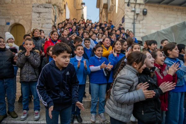 Children welcome the Custos of the Holy Land, Father Francesco Patton, upon his entrance into Bethlehem on Nov. 30, 2024, for the beginning of Advent. Credit: Marinella Bandini