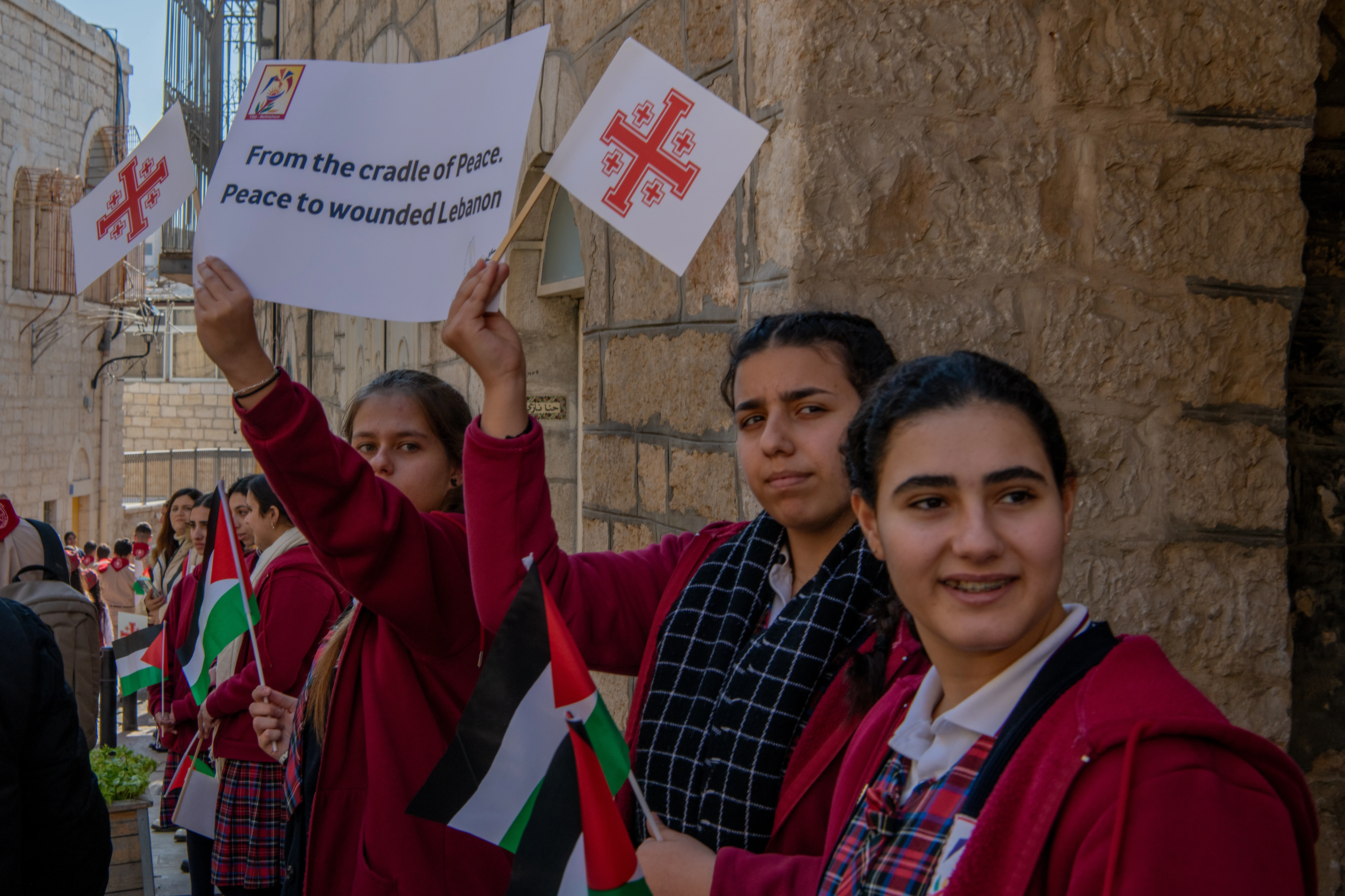 Children welcome the custos of the Holy Land, Father Francesco Patton, upon his entrance into Bethlehem on Nov. 30, 2024, for the beginning of Advent. The custos’ entry was festive, but at the same time, it was impossible to ignore the echoes of war. The children were holding signs with messages of peace and solidarity for those suffering due to the war.?w=200&h=150