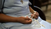 An African nun prays the rosary. On Jan. 7, 2025, two religious sisters were kidnapped in the Archdiocese of Onitsha in Nigeria.