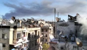 Smoke of war rises over a residential area in Aleppo. On Dec. 1, 2024, the Franciscan complex of the Terra Santa College in Aleppo was hit by a strike. No casualties were reported.