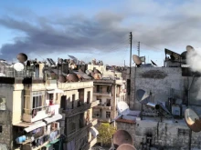 Smoke of war rises over a residential area in Aleppo. On Dec. 1, 2024, the Franciscan complex of the Terra Santa College in Aleppo was hit by a strike. No casualties were reported.