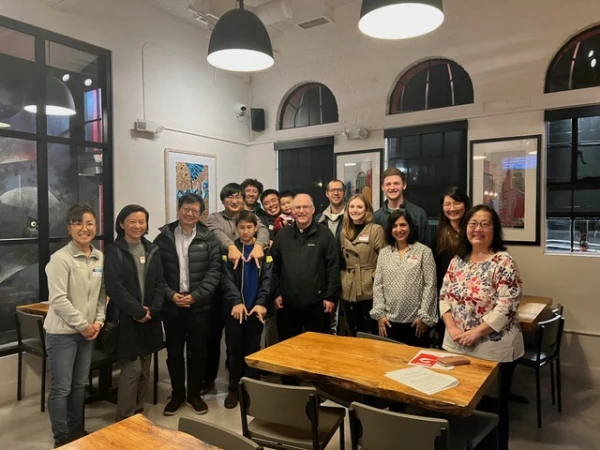 Father Bill Ashbaugh (center) with last year’s Chinese Alpha Team and several participants. Credit: Courtesy of Father Bill Ashbaugh