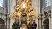 Altar of the Chair in St. Peter's Basilica, where Bernini's gorgeous bronze monument to the Chair of Peter acts as a massive
bronze reliquary for the historic wooden chair.