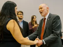 Peter Sonski, presidential candidate for the American Solidarity Party, greets a fellow presidential candidate,  pro-life Democrat Terrisa Bukovinac, following a speech at the Catholic University of America.