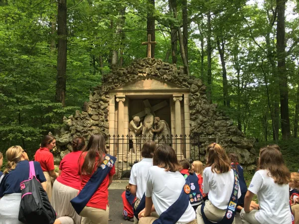 Patriot- and Pioneer-level girls kneel at Stations of the Cross in Wisconsin. Credit: Photo courtesy of American Heritage Girls