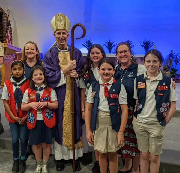 Tenderheart- and Explorer-level girls with troop leaders and Bishop William Wack after Mass in Tallahassee, Florida. Credit: Photo courtesy of American Heritage Girls