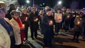 Participants pray during a peace walk in Baltimore promoted by the Archdiocese of Baltimore,  Monday, Dec. 30, 2024.