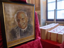 Image of Father Pedro Arrupe, SJ, beside sealed boxes of documents compiled during the diocesan phase of his canonization cause.