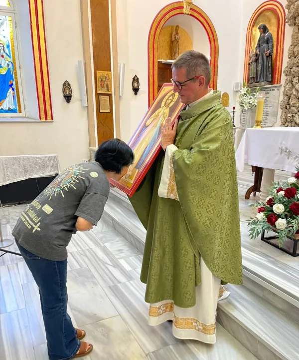 After taking catechism classes, Belkız, now 61, was baptized as a Catholic on April 25, 2011 and changed her religion from Muslim to Christian on her birth certificate. Photo credit: Nathalie Ritzmann