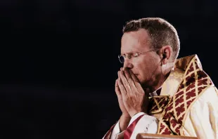 Bishop Andrew Cozzens, who spearheaded the U.S. bishops’ National Eucharistic Revival, prays in adoration of the Blessed Sacrament in Lucas Oil Stadium during the opening ceremony for the National Eucharistic Congress on July 17, 2024. Photo by Casey Johnson, in partnership with the National Eucharistic Congress.