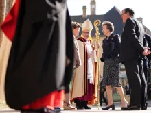 Bishop Jacques Habert of the Diocese of Bayeux and Lisieux in France greets Britain’s Princess Anne (right) on June 5, 2024, as she arrives to attend the Commonwealth War Graves Commission’s annual service of remembrance at Bayeux Cathedral in Bayeux, Normandy, northwestern France, as part of the events to mark the 80th anniversary commemorations of Allied amphibious landing (D-Day landings) in France in 1944.