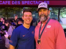 Brody Malone poses alongside his father, John, after the U.S. men’s gymnastics team won the bronze medal at the Olympic Games on July 29, 2024.