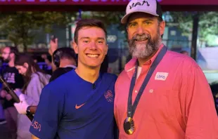 Brody Malone poses alongside his father, John, after the U.S. men’s gymnastics team won the bronze medal at the Olympic Games on July 29, 2024. Credit: Photo courtesy of the Malone family