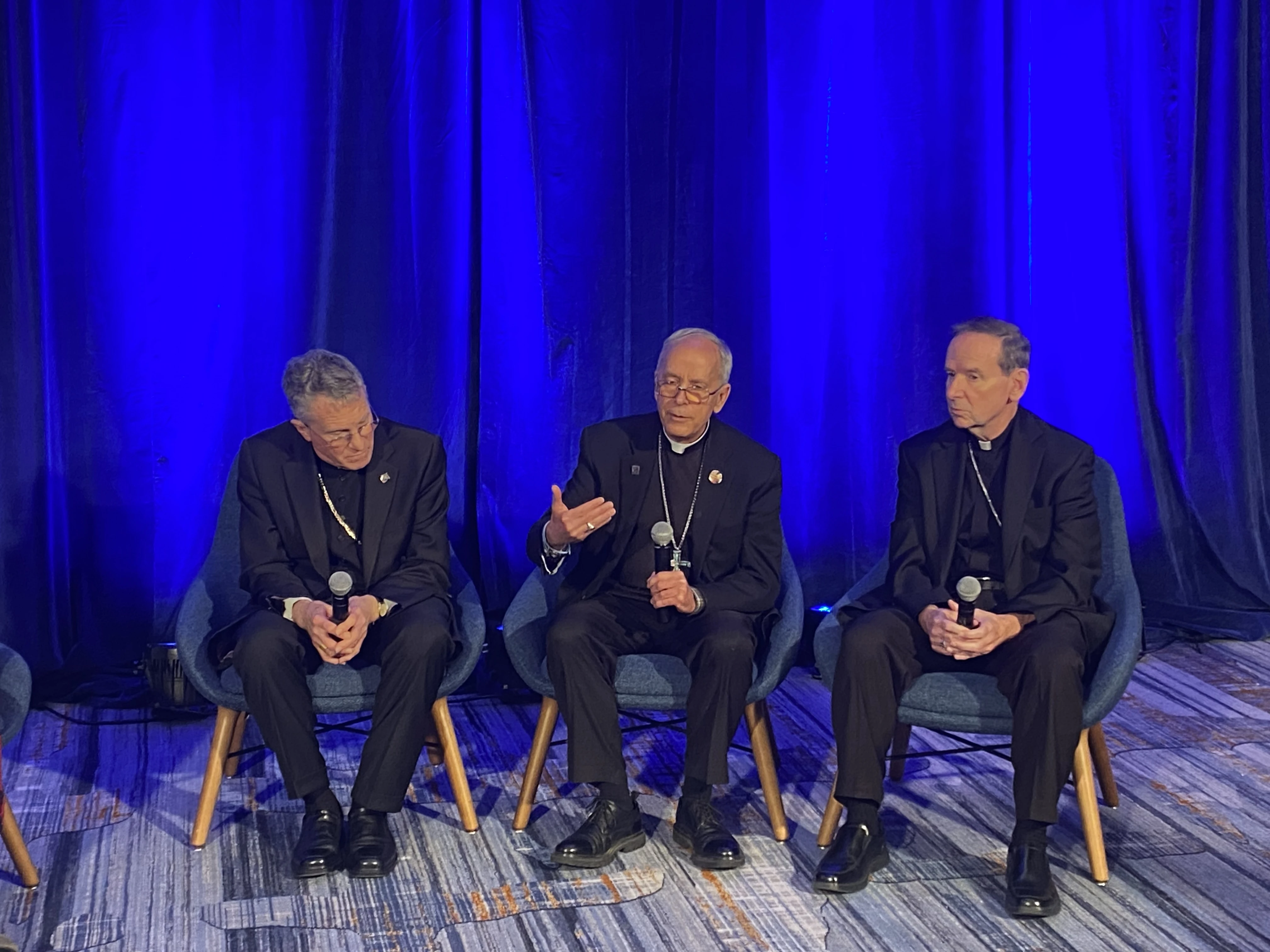 USCCB president Archbishop Timothy Broglio (left); Bishop Mark Seitz, head of the USCCB migration committee (center); and Bishop Michael Burbidge, chairman of the USCCB’s pro-life committee, speak to media at the USCCB fall plenary assembly on Nov. 12, 2024.  ?w=200&h=150