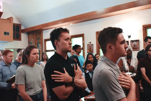 Jack Krebs (right) and other perpetual pilgrims in the Communion line at a Byzantine Divine Liturgy at Holy Protection of the Mother of God Byzantine Catholic Church in downtown Denver on June 8, 2024. Credit: Kate Quiñones/CNA