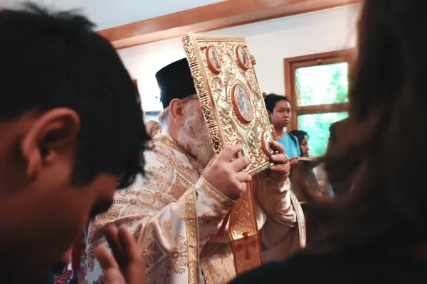 Father Joel Barstad, pastor at Holy Protection in Denver, processes with the Gospels before the Gospel reading during the Divine Liturgy on June 8, 2024. Credit: Kate Quiñones/CNA