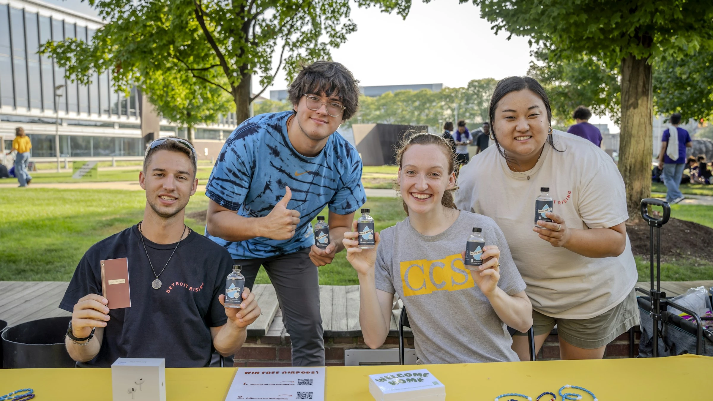 Left to right, Victor Fenik, J.P. Ledermann, Jocelyn Reiter, and Anna Picasso distribute bottles of holy water to new and returning students during the involvement fair on Aug. 26, 2024, at the College for Creative Studies in Detroit. Members of Detroit Catholic Campus Ministry have been distributing holy water at the start of the academic year at local colleges and universities for the past three years.?w=200&h=150