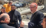 The Latin patriarch of Jerusalem, Cardinal Pierbattista Pizzaballa, speaks with Father Gabriel Romanelli, pastor of Holy Family Church, during his December 2024 visit to Gaza.