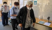 Cardinal Joseph Zen arrives at a court for his trial in Hong Kong on Sept. 26, 2022.