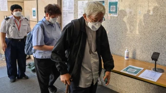 Cardinal Joseph Zen arrives at a court for his trial in Hong Kong on Sept. 26, 2022.