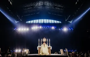 Bishop Andrew Cozzens of Crookston, Minnesota, who spearheaded the U.S. bishops’ initiative of Eucharistic Revival, adores Christ in the Eucharist with tens of thousands of people in Lucas Oil Stadium. Credit: Casey Johnson in partnership with the National Eucharistic Congress