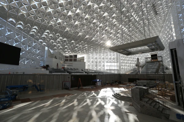 The sun sets through the distinctive quatrefoils of Christ Cathedral as construction and renovation continue inside the space formerly known as the Crystal Cathedral on Feb. 7, 2019. Credit: Challenge Roddie / Diocese of Orange