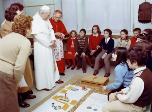 Pope John Paul II made a pastoral visit to the Our Lady of Lourdes Parish on Feb. 13, 1983, while the children were working with the catechists. Credit: Courtesy of CGSUSA archives