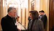 Archbishop Timothy Broglio speaks with Rep. Nancy Pelosi after a Mass held at the U.S. Capitol on Dec. 12, 2024, the feast of Our Lady of Guadalupe.