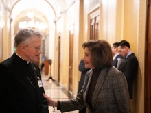 Archbishop Timothy Broglio speaks with Rep. Nancy Pelosi after a Mass held at the U.S. Capitol on Dec. 12, 2024, the feast of Our Lady of Guadalupe.