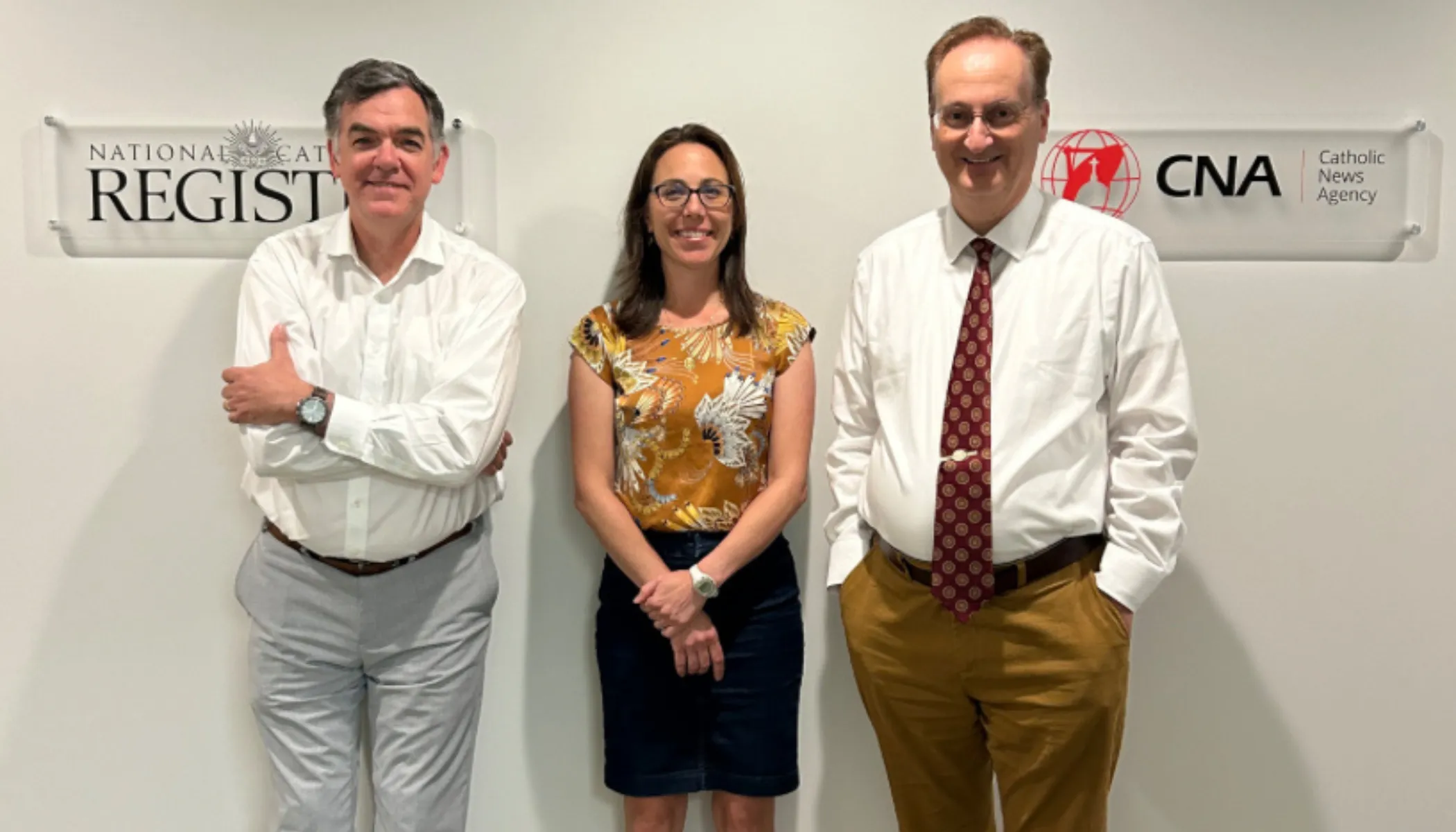 National Catholic Register Editor-in-Chief Shannon Mullen (left) and Catholic News Agency Editor-in-Chief Ken Oliver (right) flank Jeanette DeMelo (center), the executive director of the two EWTN News properties.?w=200&h=150