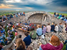 University of Mary students gather to celebrate the Blessed Mother’s birthday at the school’s grotto.